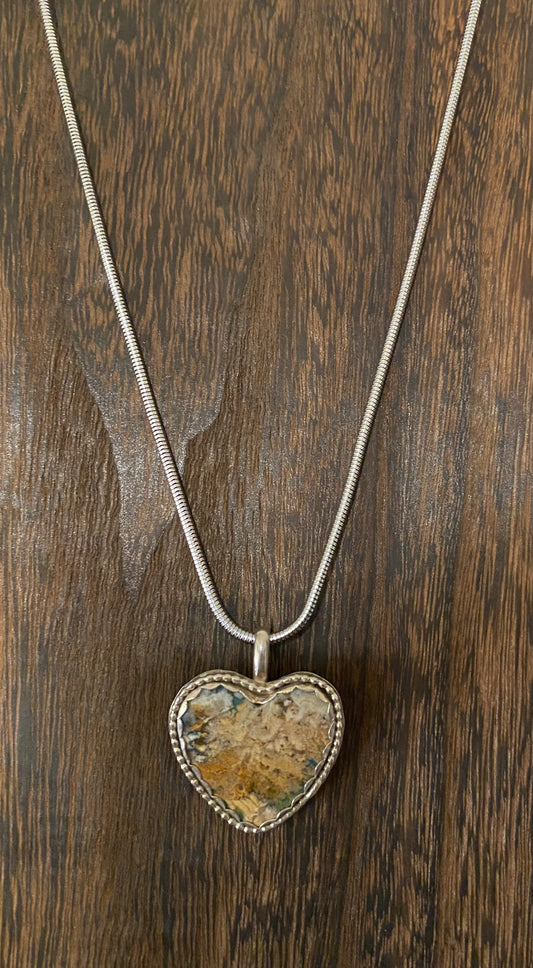 Heart shaped pendant with plume agate stone